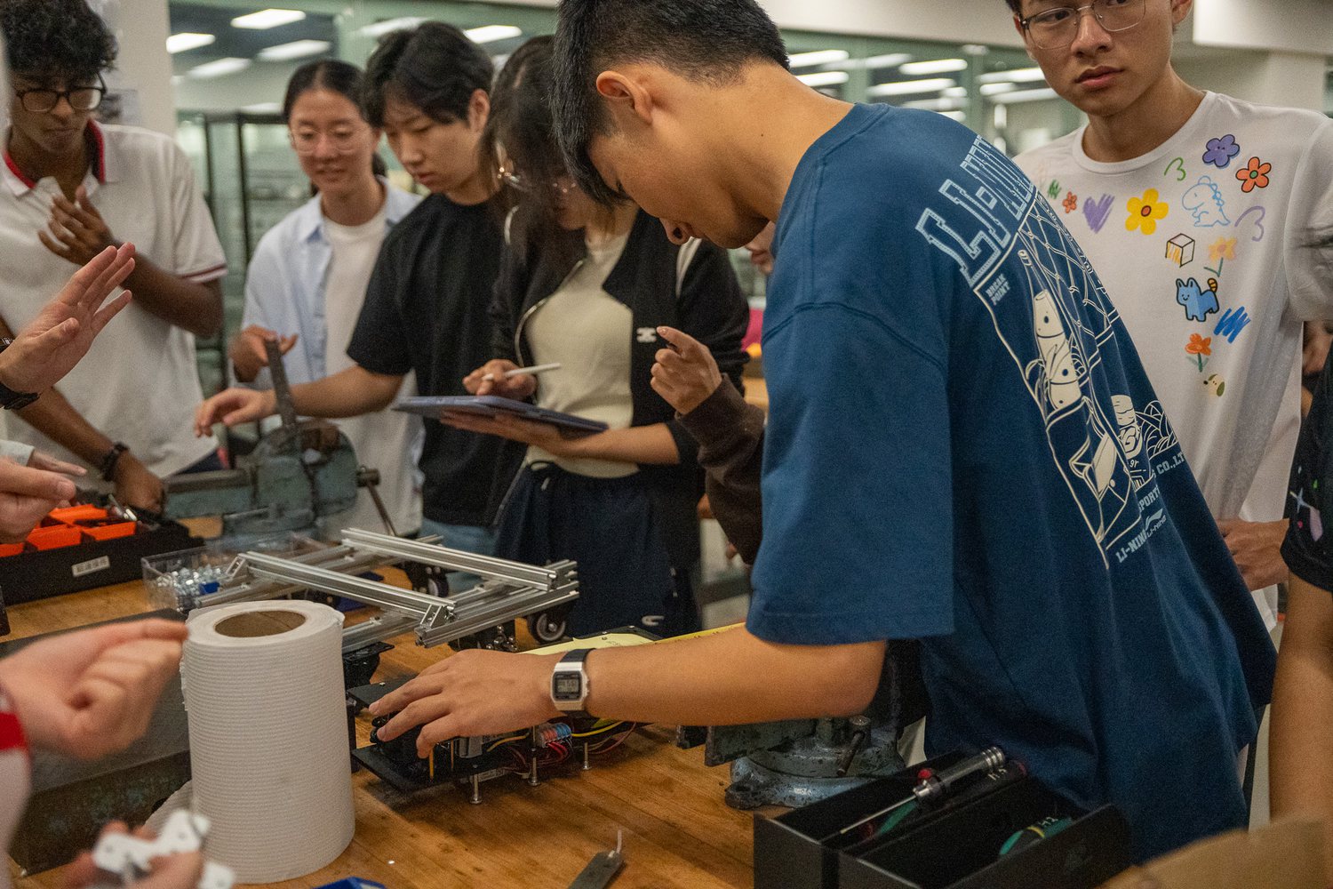Students working on hands-on robotics training