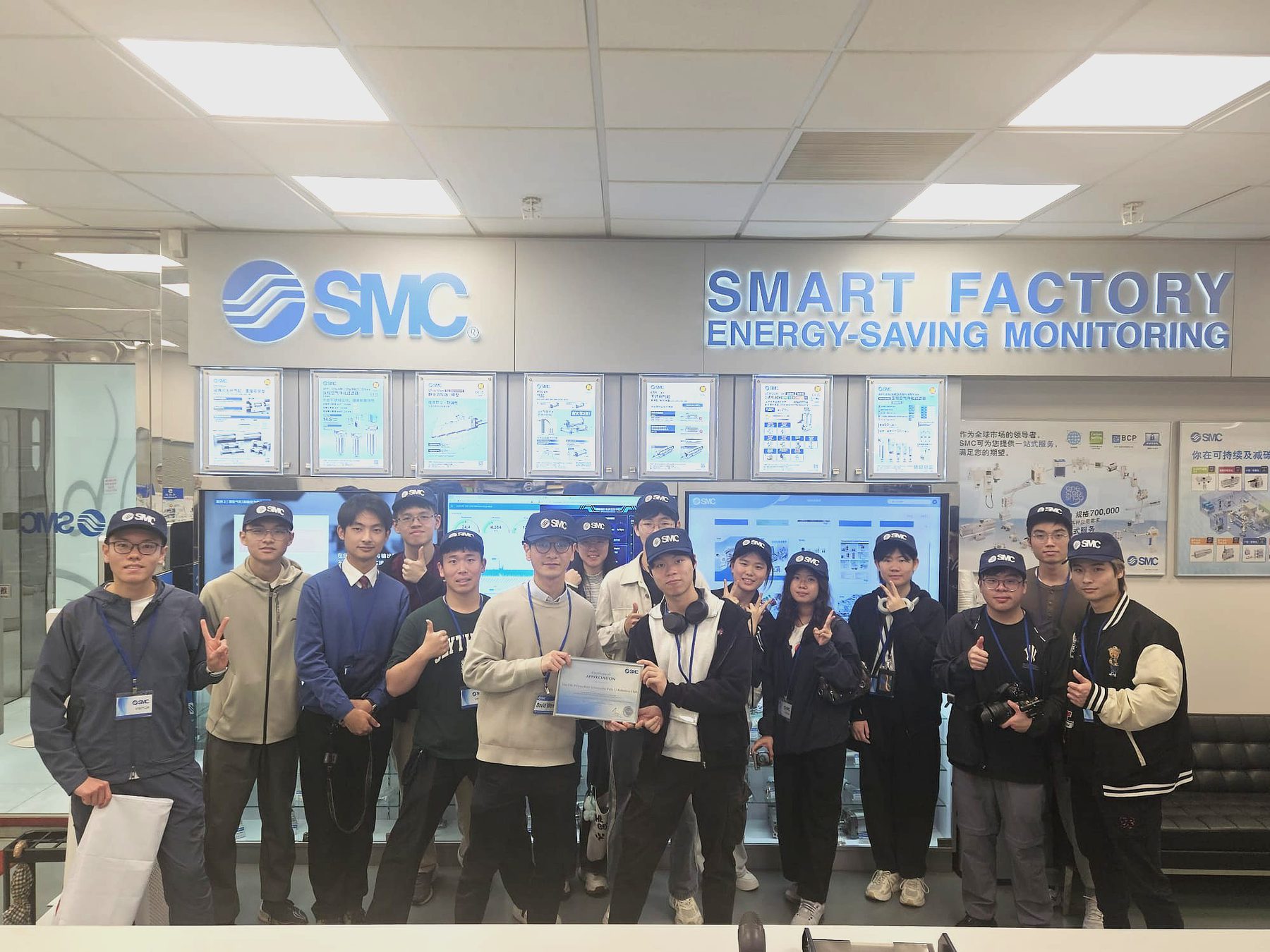Club members posing for a group photo during the SMC smart factory visit